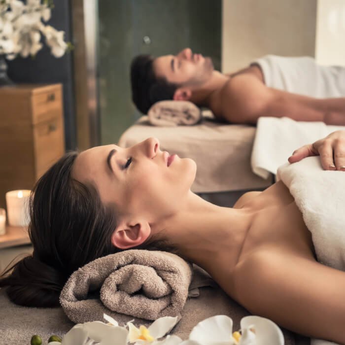 Couple getting massage in relaxing studio